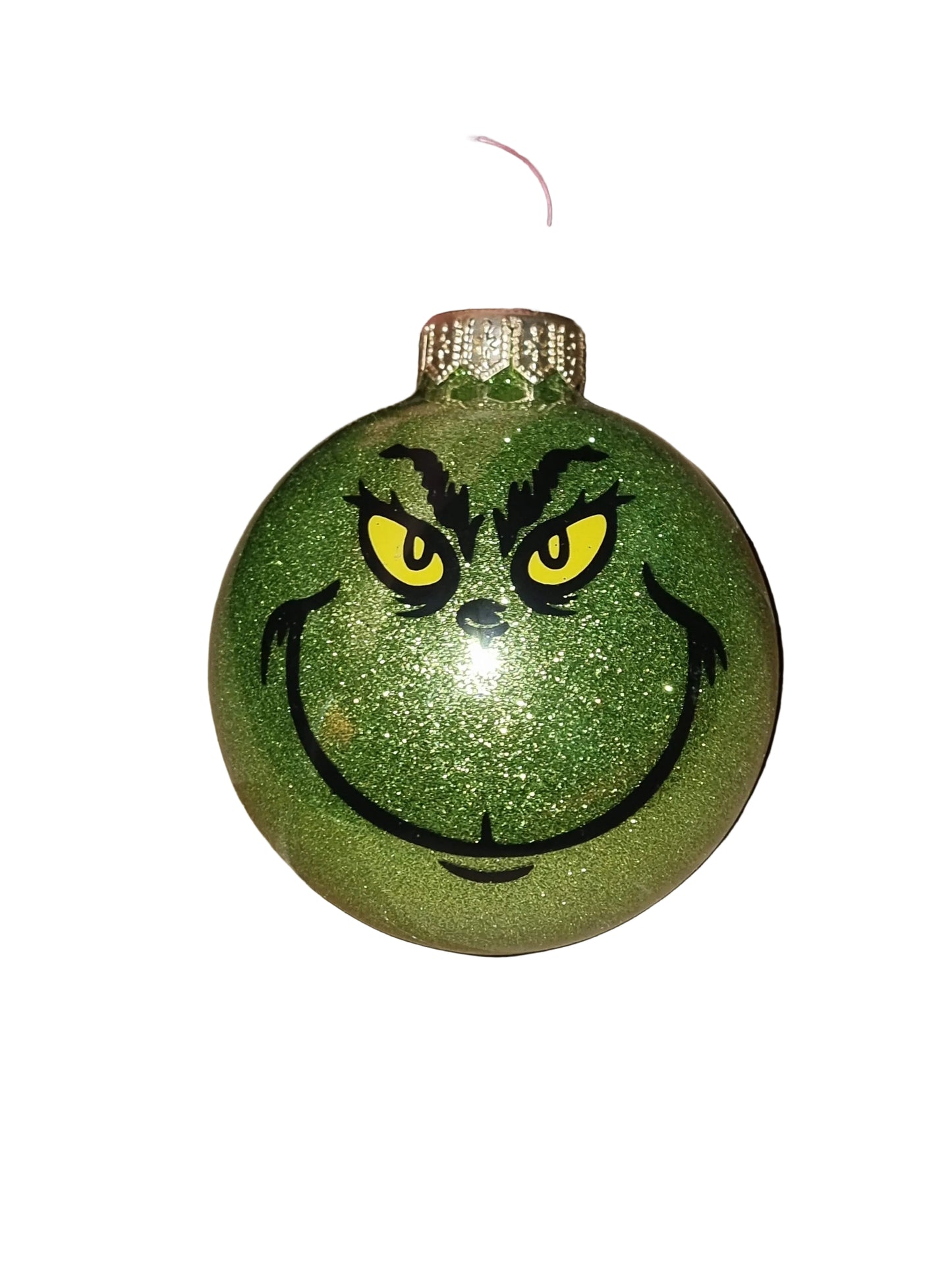 Green glittery Grinch ornament with a face 