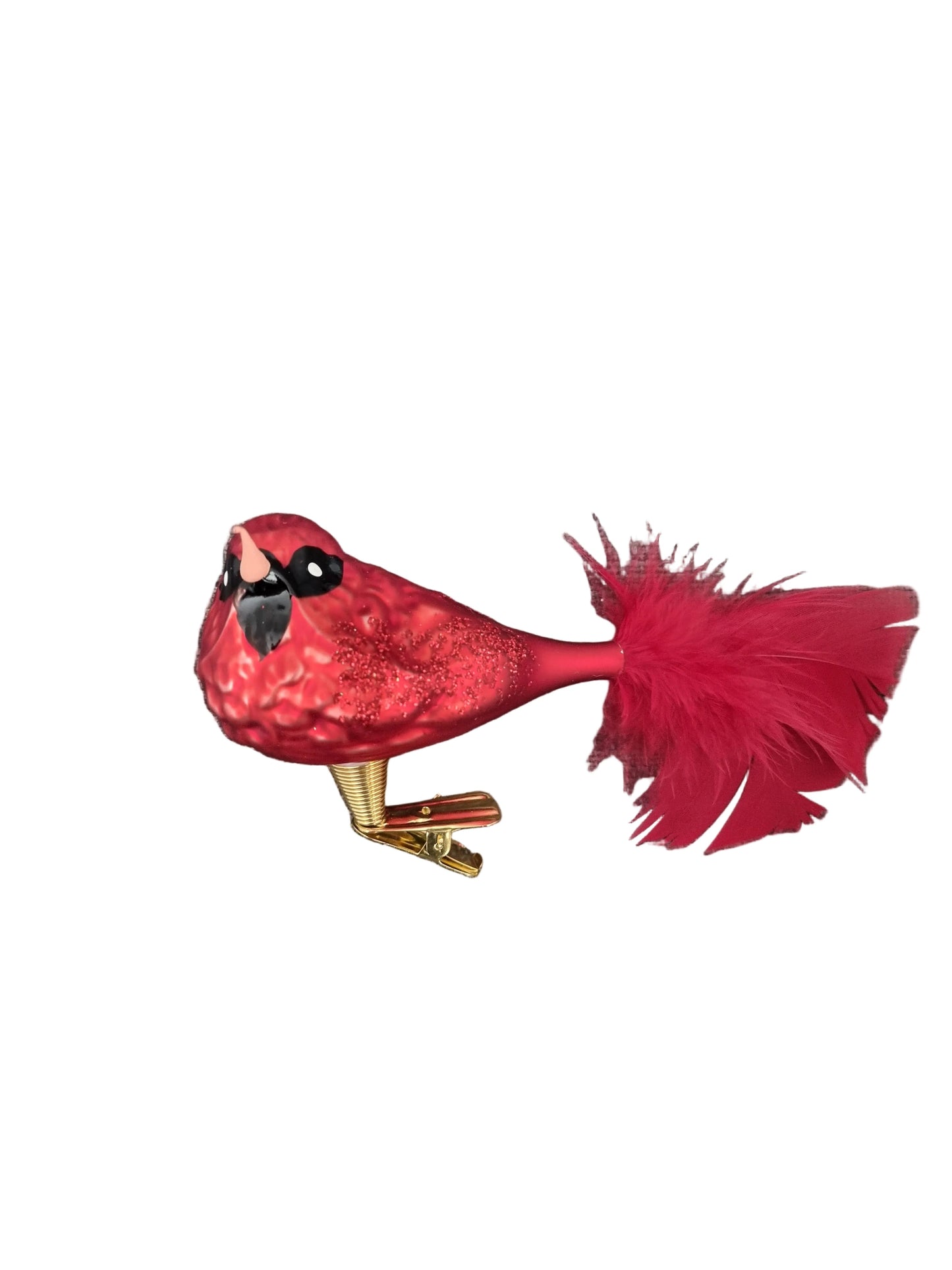 Red glass cardinal bird ornament on a white background
