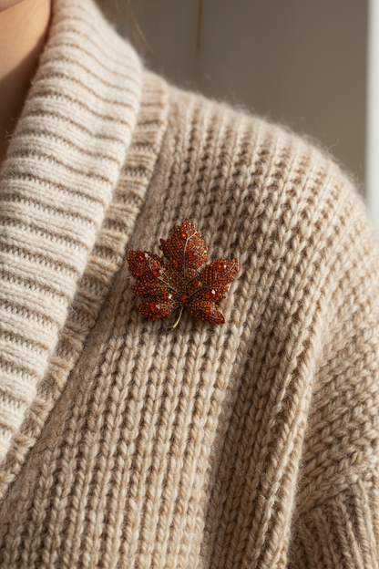 Maple leaf brooch on a textured beige sweater