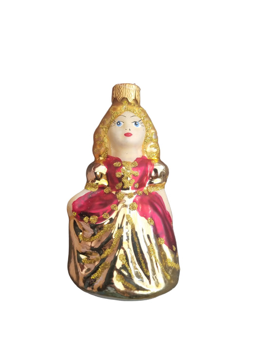 Decorative ornament shaped like a princess with gold and red details