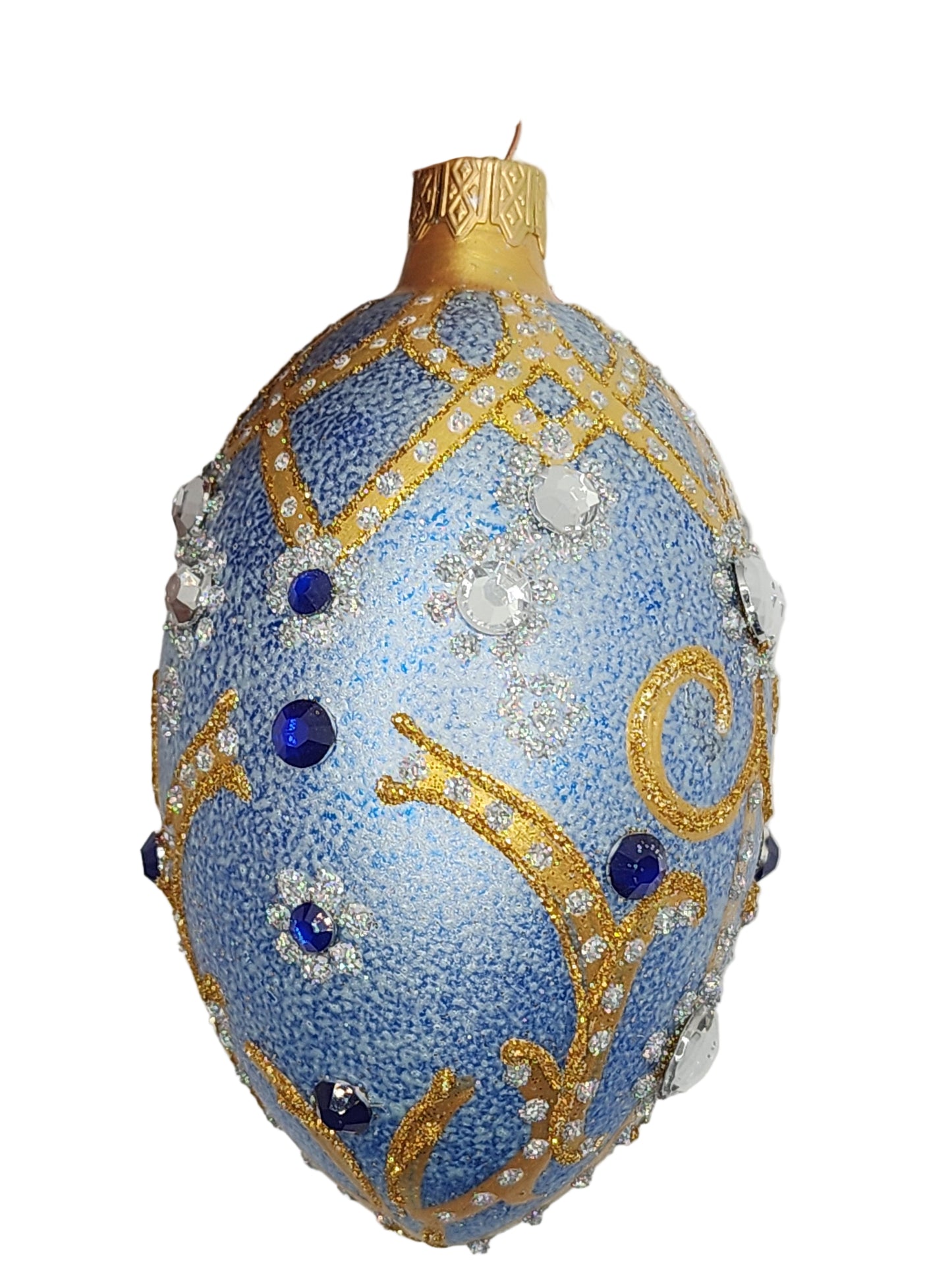 Decorative blue egg with gold and blue accents on a white background