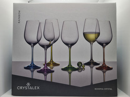 Box of Crystalex wine glasses with a colorful design on a gray background