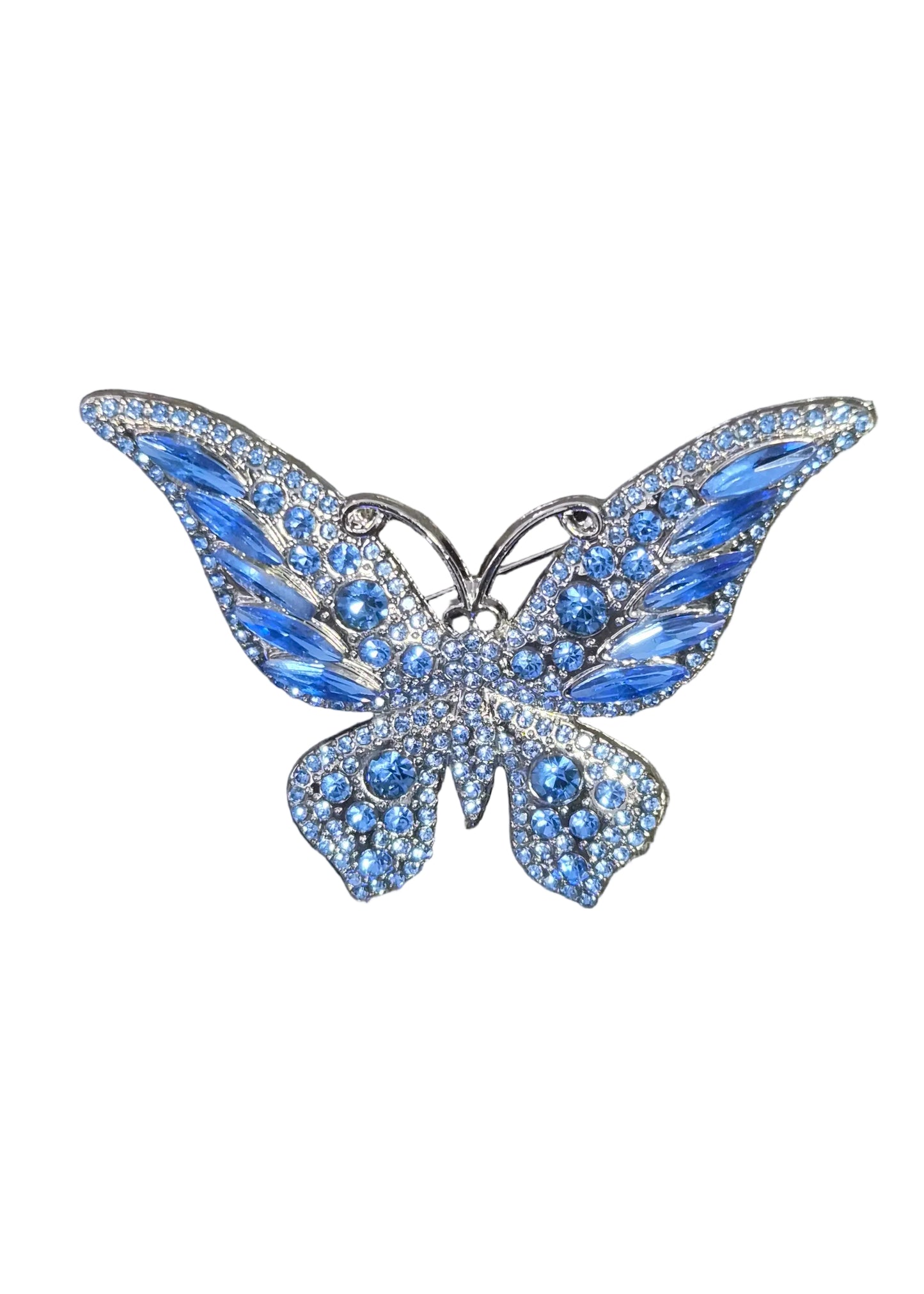 A butterfly-shaped brooch embellished with blue crystals and silver metal