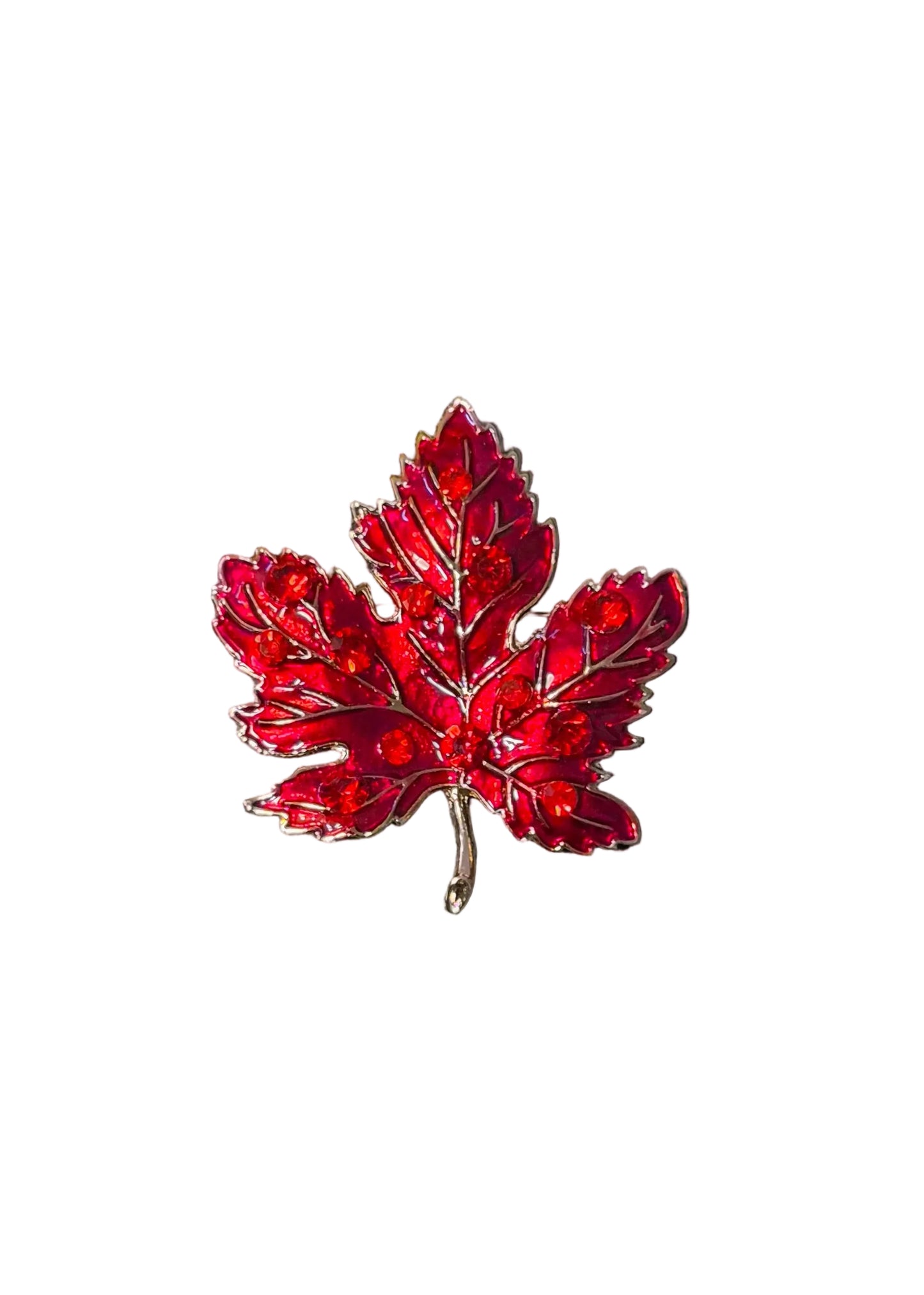 A red maple leaf enamel pin with silver metal outlines