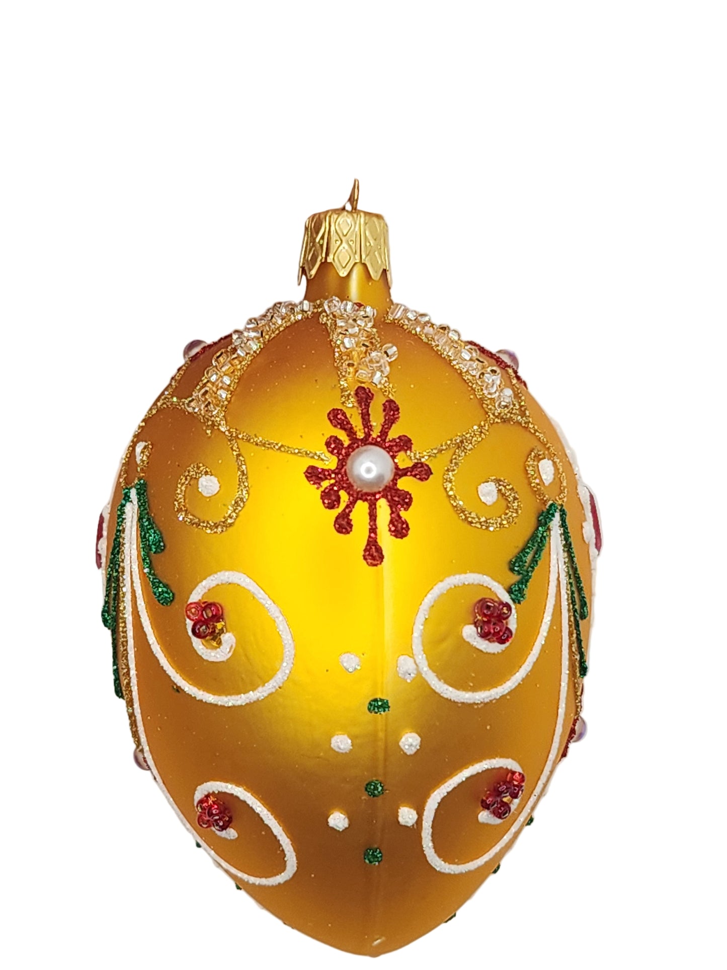 Decorative yellow egg with intricate designs on a white background