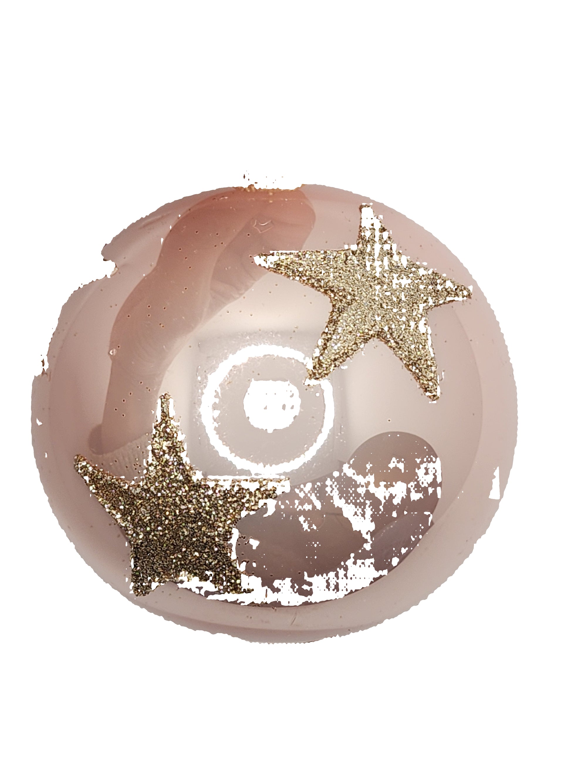 Pink decorative ball with gold stars held by a hand against a white background