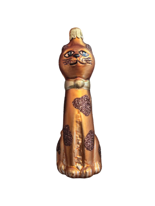 Bronze-colored cat with intricate designs 